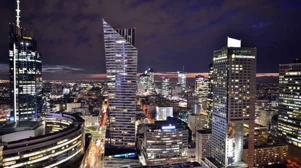 stock image Warsaw, Poland. 14 March 2023. Beautiful architecture of Warsaw city center with modern skyscrapers at night.