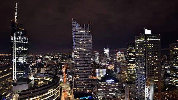 stock image Warsaw, Poland. 14 March 2023. Beautiful architecture of Warsaw city center with modern skyscrapers at night.