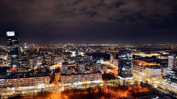 stock image Warsaw, Poland. 14 March 2023. Beautiful architecture of Warsaw city center with modern skyscrapers at night.