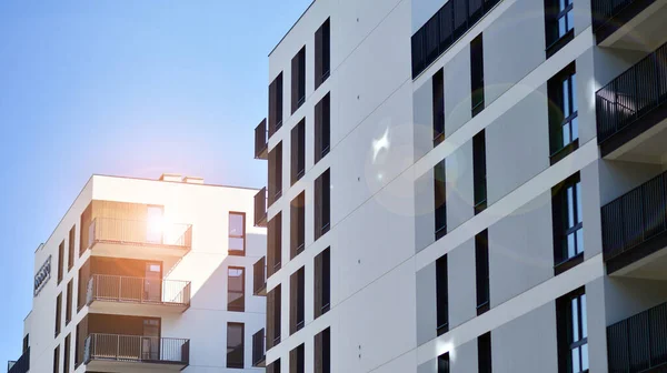 stock image Modern apartment buildings on a sunny day with a blue sky. Facade of a modern apartment building. Contemporary residential building exterior in the daylight. 