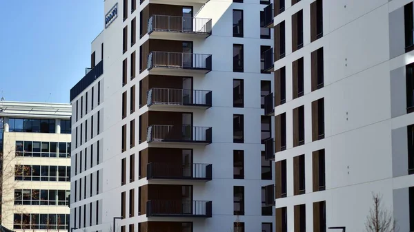 stock image Modern apartment buildings on a sunny day with a blue sky. Facade of a modern apartment building. Contemporary residential building exterior in the daylight. 