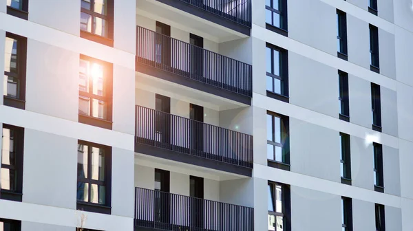 stock image  Modern apartment buildings on a sunny day with a blue sky. Facade of a modern apartment building. Contemporary residential building exterior in the daylight. 