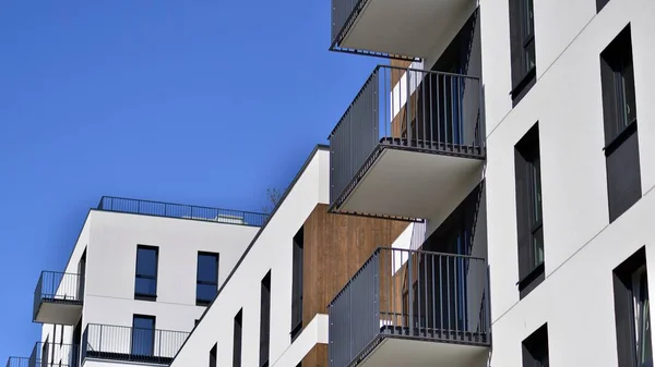 stock image  Modern apartment buildings on a sunny day with a blue sky. Facade of a modern apartment building. Contemporary residential building exterior in the daylight. 