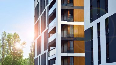 Eco architecture. Green tree and new apartment building. The harmony of nature and modernity. Modern residential building with new apartments in a green residential area.  clipart