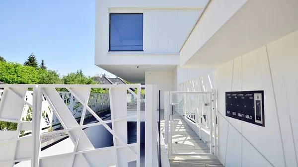 Elegant white house with open concept. Modern luxury villa exterior. A modern house with large windows and glazing.