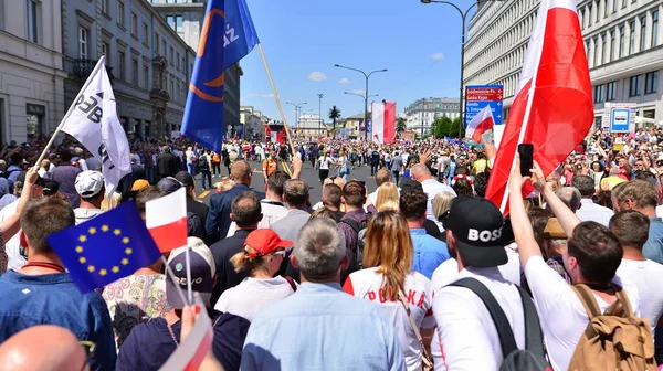 stock image Warsaw, Poland. 4 June 2023. Hundreds of thousands march in  anti-government protest to show support for democracy. The spontaneous reaction of people during the great March of the opposition.