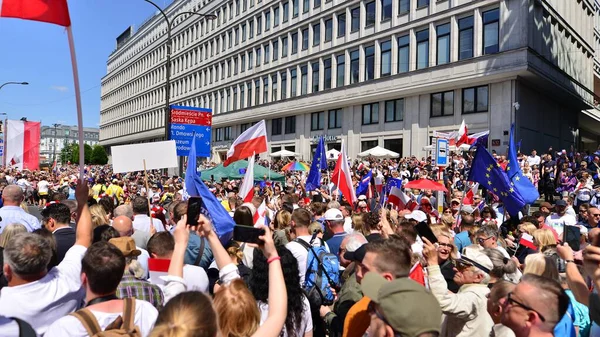 stock image Warsaw, Poland. 4 June 2023. Hundreds of thousands march in  anti-government protest to show support for democracy. The spontaneous reaction of people during the great March of the opposition.