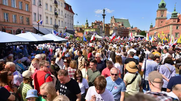 stock image Warsaw, Poland. 4 June 2023. Hundreds of thousands march in  anti-government protest to show support for democracy. The spontaneous reaction of people during the great March of the opposition.