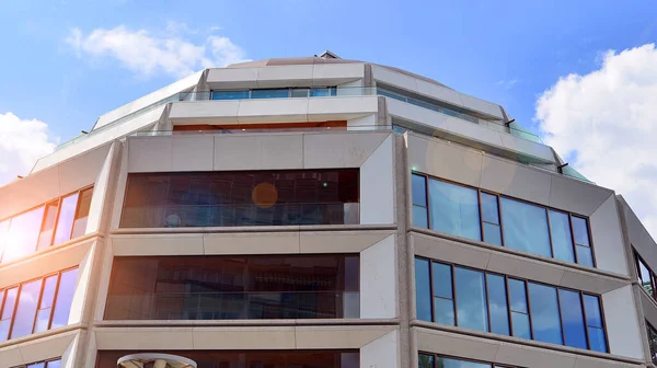 stock image New apartment building with glass balcony terraces of very modern architecture.