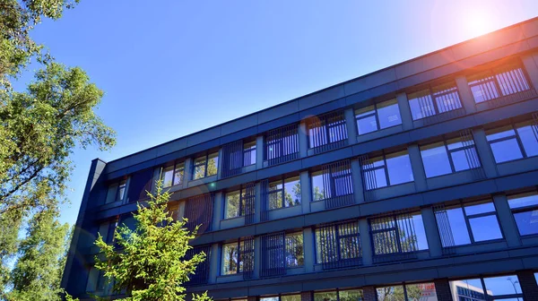 stock image Sustainable glass office building with trees for reducing carbon dioxide. Eco-friendly building in modern city. Office with green environment. Corporate building reduce CO2.