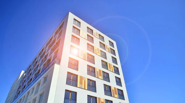 stock image Contemporary residential building exterior in the daylight. Modern apartment buildings on a sunny day with a blue sky. Facade of a modern apartment building. 