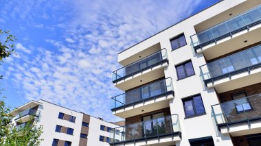 Eco city with modern exterior design of apartment building and landscaping. Garden yard by residential buildings.. Contemporary eco friendly residential architecture. Eco-friendly living in a city.