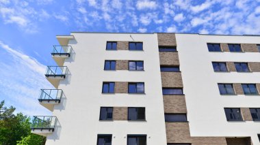 Eco city with modern exterior design of apartment building and landscaping. Garden yard by residential buildings.. Contemporary eco friendly residential architecture. Eco-friendly living in a city.