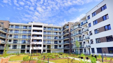 Eco city with modern exterior design of apartment building and landscaping. Garden yard by residential buildings.. Contemporary eco friendly residential architecture. Eco-friendly living in a city.