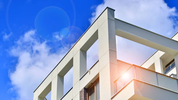 stock image  Modern residential building with new apartments in a green residential area. Eco architecture. Green tree and new apartment building. The harmony of nature and modernity.