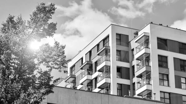 stock image Modern apartment building in sunny day. Exterior, residential house facade. Black and white.