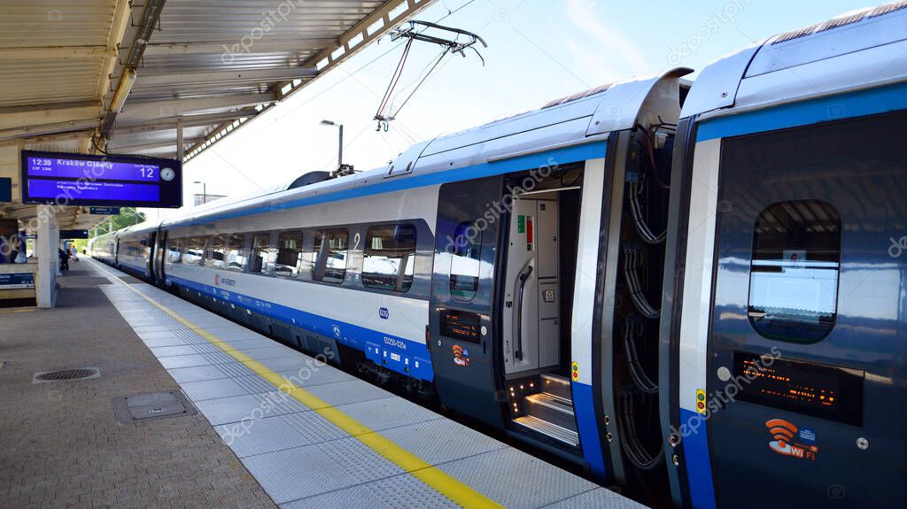 Warsaw, Poland. 5 September 2023. PKP Intercity Polish train sleeping car at station platform awaiting departure in late afternoon. PKP intercity Pendolino train.