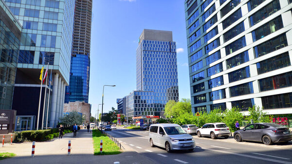 Warsaw, Poland. 11 April 2024. Car traffic at rush hour in downtown area of the city. City center with cars and buildings in the background.