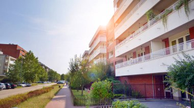 Warsaw, Poland. 24 August 2024. Ursynow district intensive residential developments in this modern residential buildings and wide streets with pedestrian and car traffic near Las Kabacki Forest. clipart