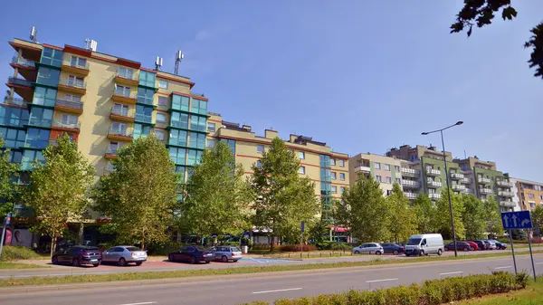 stock image Warsaw, Poland. 24 August 2024. Ursynow district intensive residential developments in this modern residential buildings and wide streets with pedestrian and car traffic near Las Kabacki Forest.