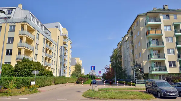 stock image Warsaw, Poland. 24 August 2024. Ursynow district intensive residential developments in this modern residential buildings and wide streets with pedestrian and car traffic near Las Kabacki Forest.