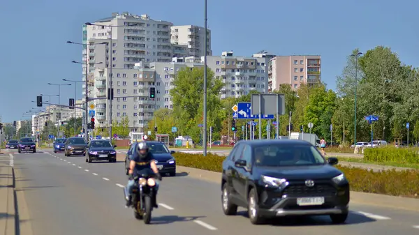 stock image Warsaw, Poland. 24 August 2024. Ursynow district intensive residential developments in this modern residential buildings and wide streets with pedestrian and car traffic near Las Kabacki Forest.