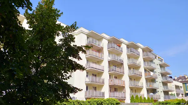 stock image Low angle view apartment building  from the beginning of the 21st century. Architectural elements of apartment building. Green surroundings of buildings. Ecological housing estate.