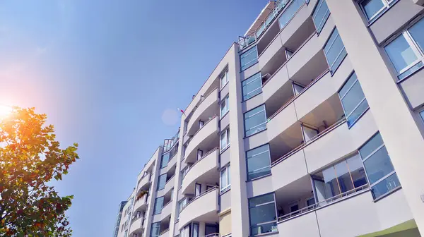 stock image Low angle view apartment building  from the beginning of the 21st century. Architectural elements of apartment building. Green surroundings of buildings. Ecological housing estate.