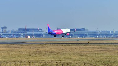 Warsaw ,Poland. 9 February 2025. Plane HA-LTD - Airbus A321-231 - Wizz Air just before landing at the Chopin airport. clipart