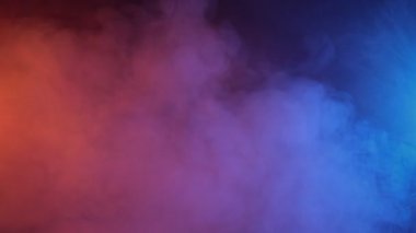 Yavaş çekim turuncu ve mavi duman soyut arkaplan.