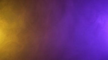 Sarı ve mor tamamlayıcı kontrastlı duman soyut arkaplan