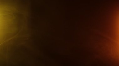 Yavaş hareket eden turuncu ve sarı renkli duman efekti neon ışıklarıyla