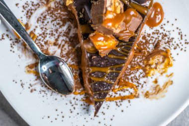 Dark chocolate and caramel cake on a plate