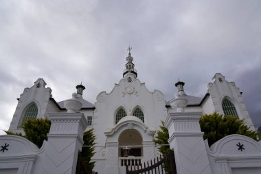 Swellendam, South Africa - 17 November 2022: Historic buildings in the Cape Dutch style of architecture in the town of Swellendam, Western Cape, South Africa