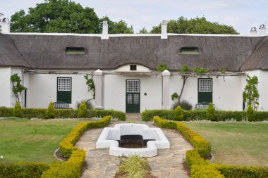 Swellendam, South Africa - 18 November 2022: Historic buildings in the Cape Dutch style of architecture that form the Drostdy Museum in Swellendam, Western Cape, South Africa