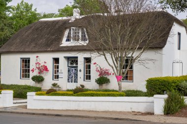 Swellendam, South Africa - 18 November 2022: Historic buildings in the Cape Dutch style of architecture in the town of Swellendam, Western Cape, South Africa