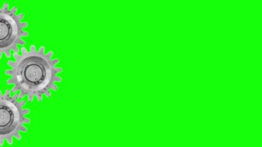 Üç metal dişli dönmeye başlar, döner ve durur. Sol taraftaki yeşil ekranda izole edilmiş, sağ tarafında kopyalama alanı olan..