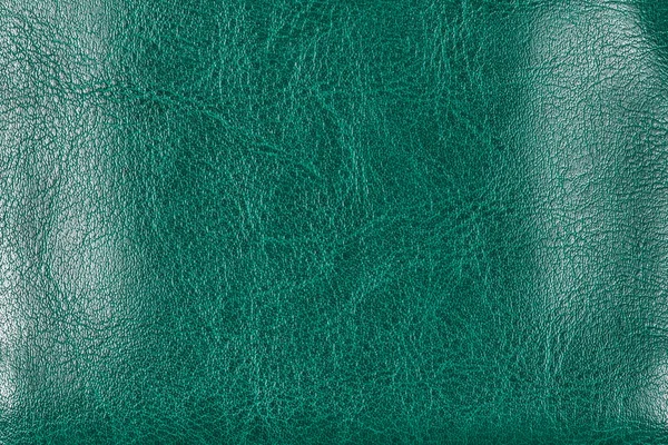 Turquoise textured finished leather, close-up.