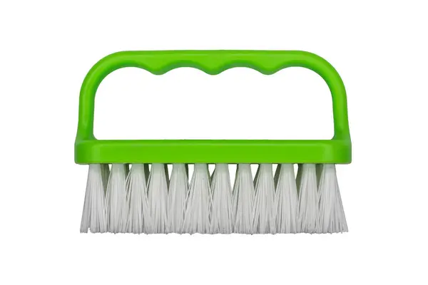 Stock image Handheld brush with a green plastic handle and white bristles is isolated.