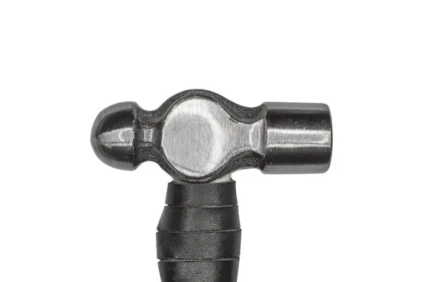 stock image Ball peen hammer head, featuring a smooth, metallic finish and a classic design with a round face and a flattened striking surface is isolated, close up.