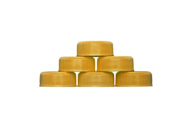 Yellow plastic HDPE caps pyramide from drinking water bottles isolated on a transparent background. clipart