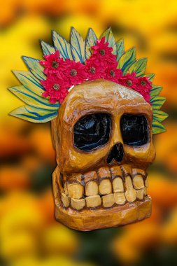 Handcrafted Mexican catrinas made from papier-mch and adorned with vibrant marigold flowers celebrating the traditional Day of the Dead clipart