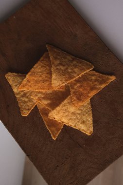 Corn chips. Triangular note. Mexican food. Crispy snack. Snack for beer. St. Patrick's Day. March 17.