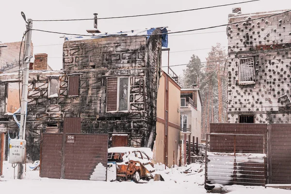 War in Ukraine. Russian aggression. Terrorist attack. Ruined house. Burnt houses and cars. Tragedy in a peaceful Ukrainian town. Russian terrorist state. A destroyed and burned residential building as a result of Russian aggression in Ukraine.