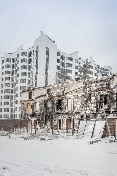 War in Ukraine. Russian aggression. Terrorist attack. Ruined house. Burnt houses and cars. Tragedy in a peaceful Ukrainian town. Russian terrorist state. A destroyed and burned residential building as a result of Russian aggression in Ukraine.