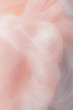 Yumuşak kumaş arka plan. Pembe ve gri karışımı. Soğuk ve sıcak. Renkli tül. Romantik düğün kartı. Aşk havası. Tekstil endüstrisi.