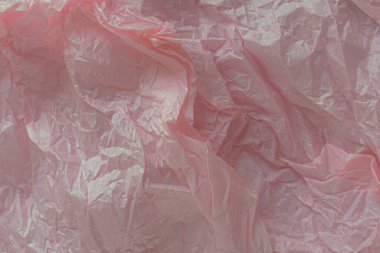 Texture of crumpled thin paper. Abstract background. Paper wall. Interior design. Decorative element. Patterns of cut paper. A rustling surface. Pink paper background. clipart