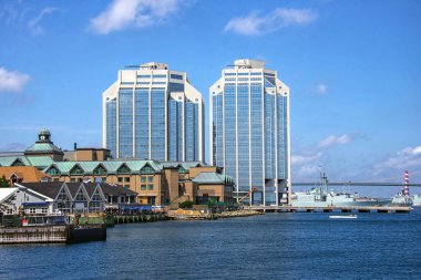 Halifax waterfront with naval battleship and MacDonald Bridge in the background clipart