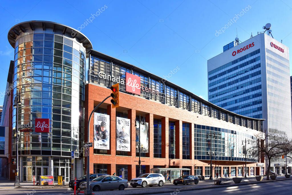 Winnipeg, Canada - April 6, 2025: Canada Life Centre, which opened in 2004 as MTS Centre, on Portage Ave is the home of the NHL Winnipeg Jets, AHL Manitoba Moose and the Sea Bears of the Canadian Elite Basketball League. The Rogers building is adjace
