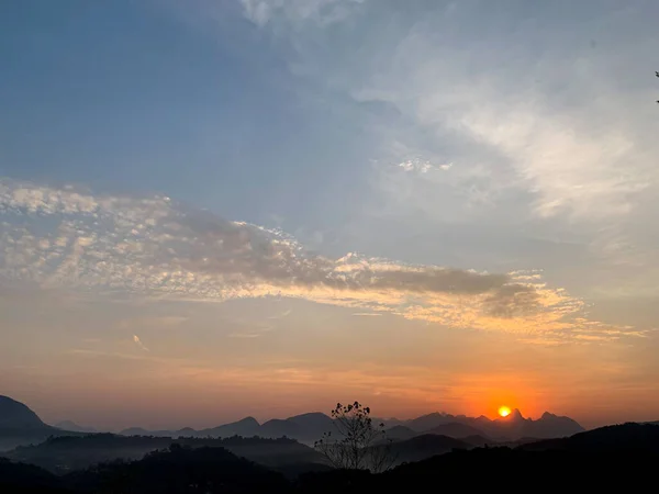 stock image Sun rising on the mountains in the countryside.